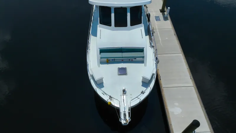 Slide: The Image of Aerial view of 2005 Jefferson Marquessa 60 MY yacht docked at a marina. - 13