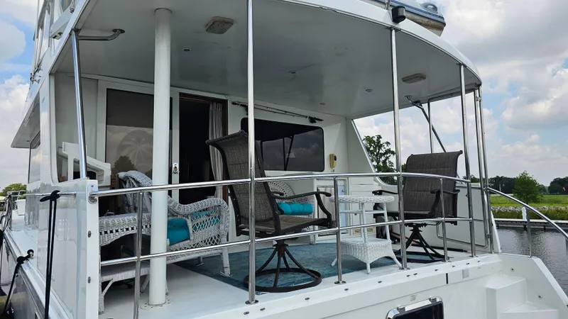 Slide: The Image of 2005 Jefferson Marquessa 60 MY yacht deck with outdoor seating and railing. - 15