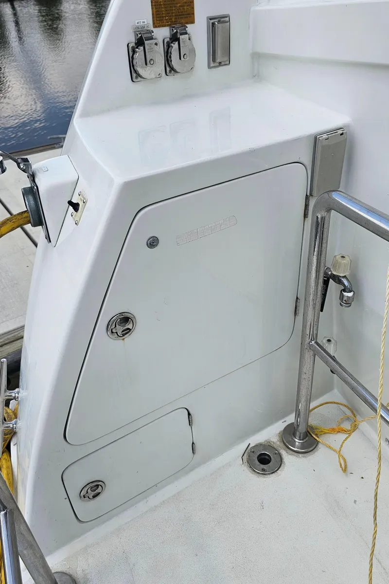 Slide: The Image of 2005 Jefferson Marquessa 60 MY yacht deck with storage compartment and railing. - 17