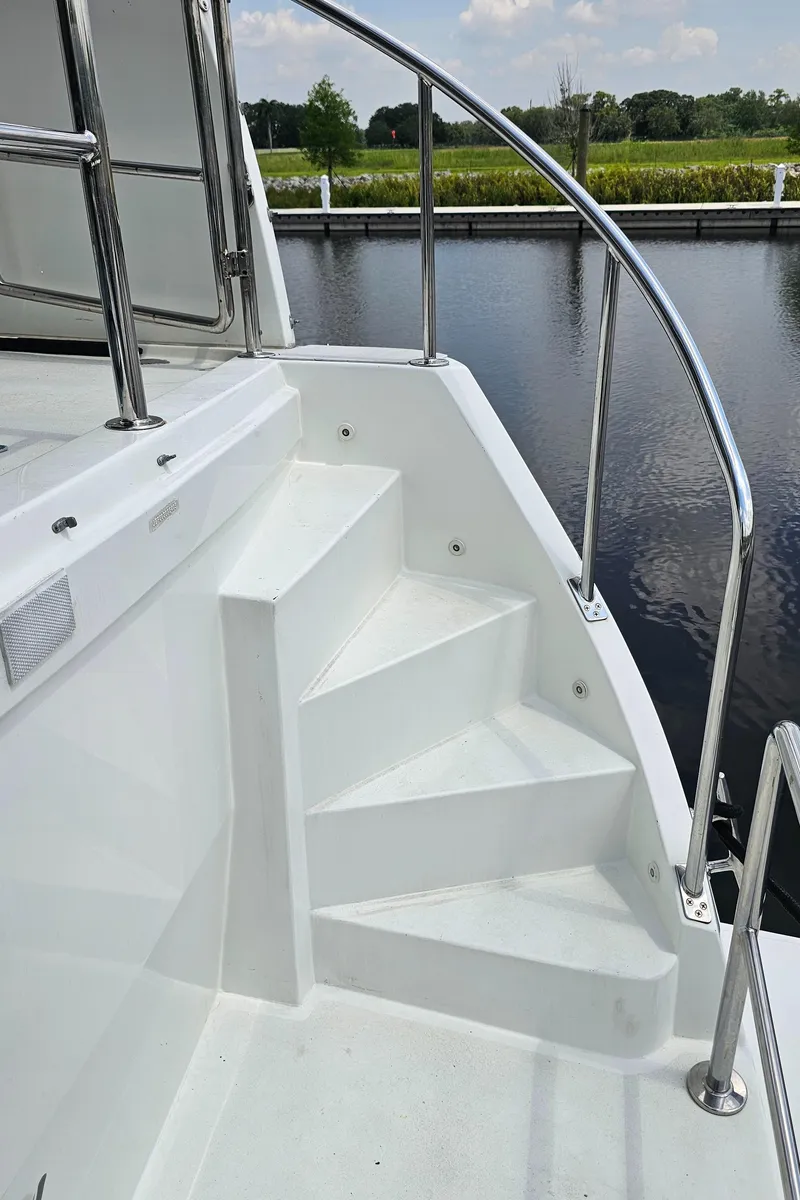 Slide: The Image of Staircase on 2005 Jefferson Marquessa 60 MY yacht, with stainless steel railing by the water. - 19