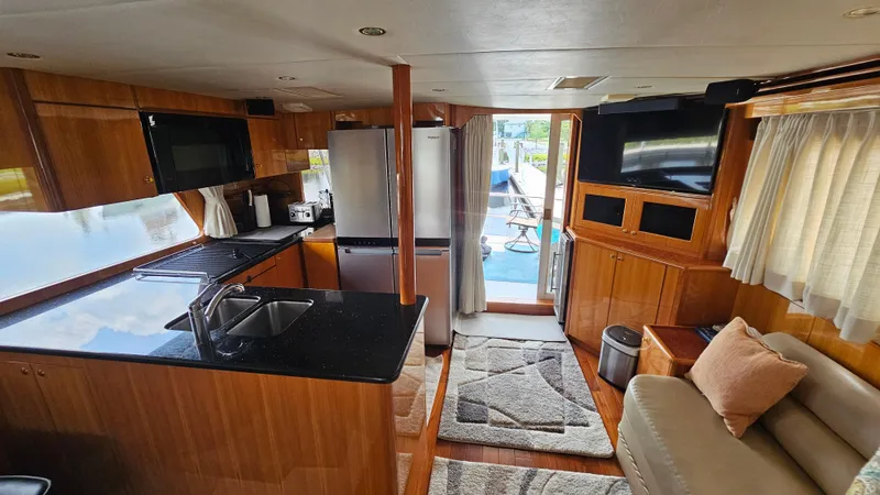 Slide: The Image of Luxurious interior of 2005 Jefferson Marquessa 60 MY yacht with modern kitchen and cozy seating area. - 29