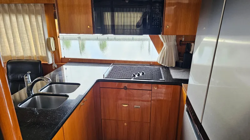 Slide: The Image of Luxurious kitchen interior of 2005 Jefferson Marquessa 60 MY yacht with modern amenities. - 30