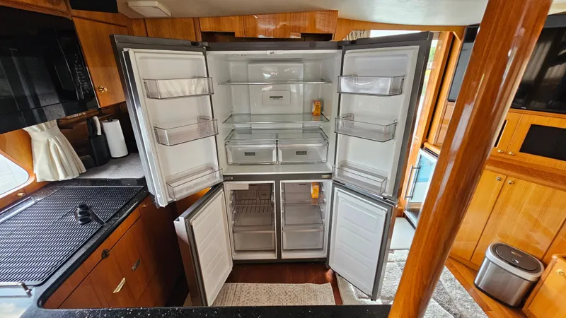 Slide: The Image of Open refrigerator in the kitchen of a 2005 Jefferson Marquessa 60 MY yacht. - 32