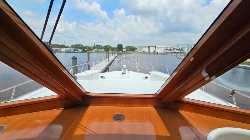 Slide: The Image of View from the helm of a 2005 Jefferson Marquessa 60 MY yacht, docked at a marina. - 36