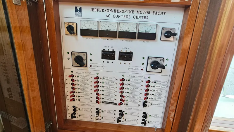 Slide: The Image of AC control panel of 2005 Jefferson Marquessa 60 MY motor yacht, featuring various switches and gauges. - 43