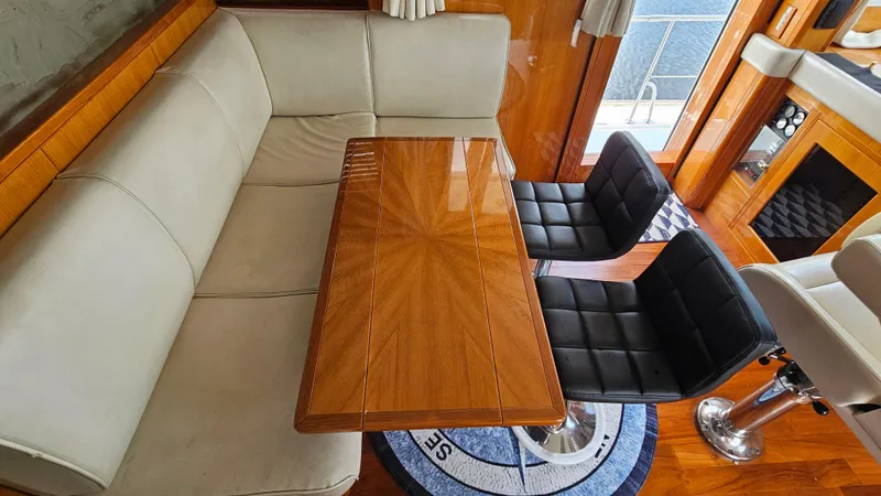 Slide: The Image of Luxurious interior of 2005 Jefferson Marquessa 60 MY yacht with elegant seating and wooden table. - 45