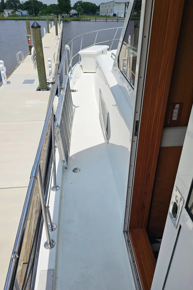 Slide: The Image of 2005 Jefferson Marquessa 60 MY yacht docked, showing side deck and railing. - 46