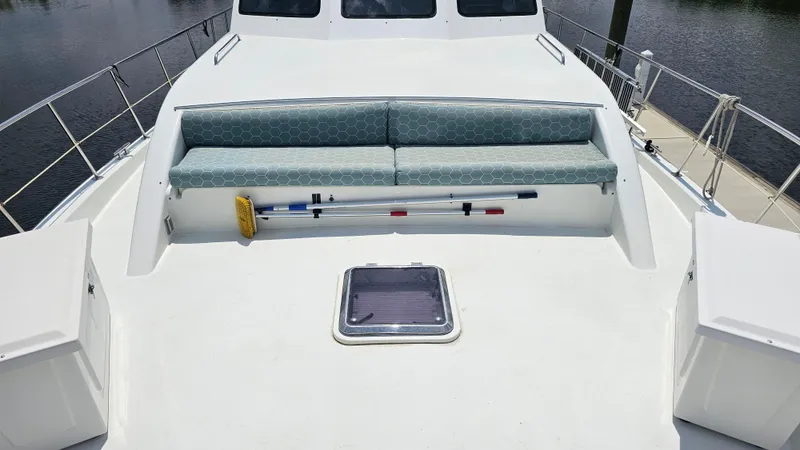 Slide: The Image of 2005 Jefferson Marquessa 60 MY yacht deck with cushioned seating and cleaning tools. - 47