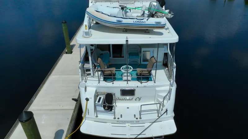Slide: The Image of Aerial view of 2005 Jefferson Marquessa 60 MY yacht docked with dinghy on top. - 5