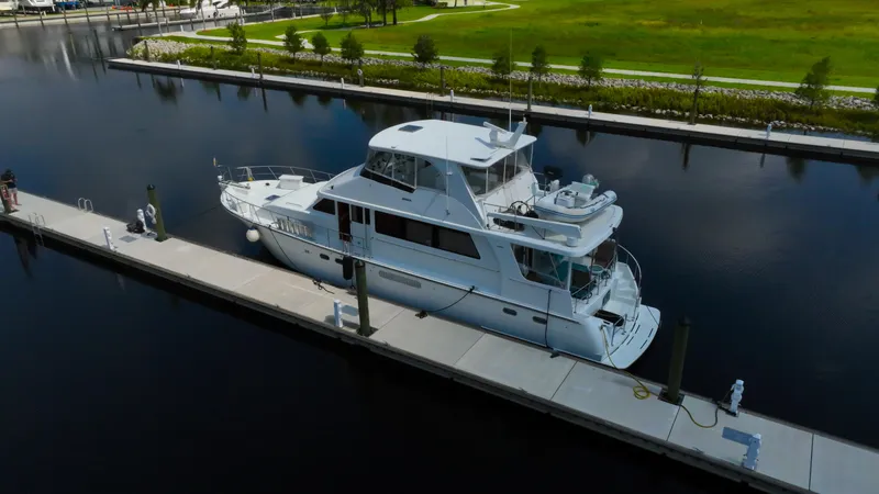 Slide: The Image of 2005 Jefferson Marquessa 60 MY yacht docked at a marina, aerial view. - 8