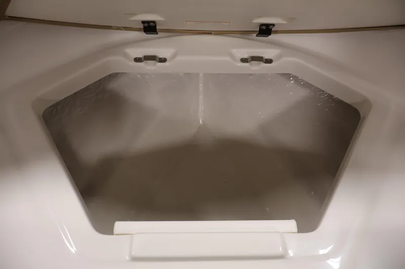 Slide: The Image of 2026 Bayliner V20 storage compartment, open and empty, showcasing interior space. - 12