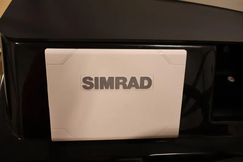 Slide: The Image of Simrad navigation system on 2026 Bayliner V20 boat dashboard. - 16