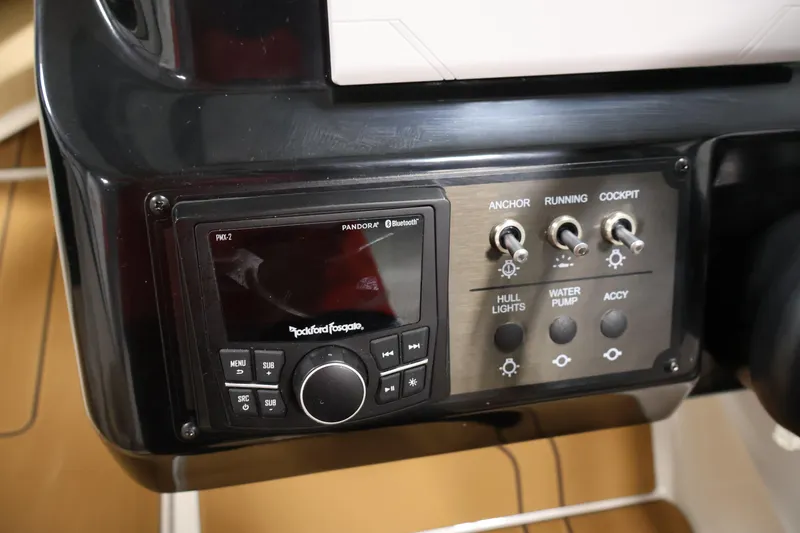 Slide: The Image of Control panel of 2026 Bayliner V20 boat with audio system and switches. - 18