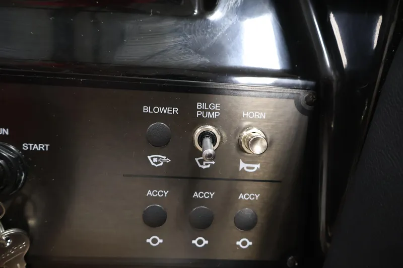 Slide: The Image of Control panel of 2026 Bayliner V20 boat with blower, bilge pump, and horn switches. - 19