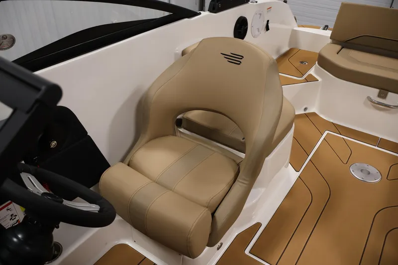 Slide: The Image of 2026 Bayliner V20 boat interior with tan seating and modern design. - 20