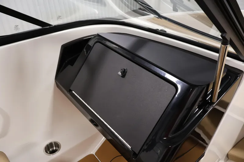 Slide: The Image of 2026 Bayliner V20 boat dashboard with sleek black panel and windshield. - 22