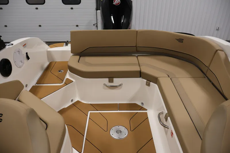 Slide: The Image of 2026 Bayliner V20 boat interior with tan seating and modern design. - 28