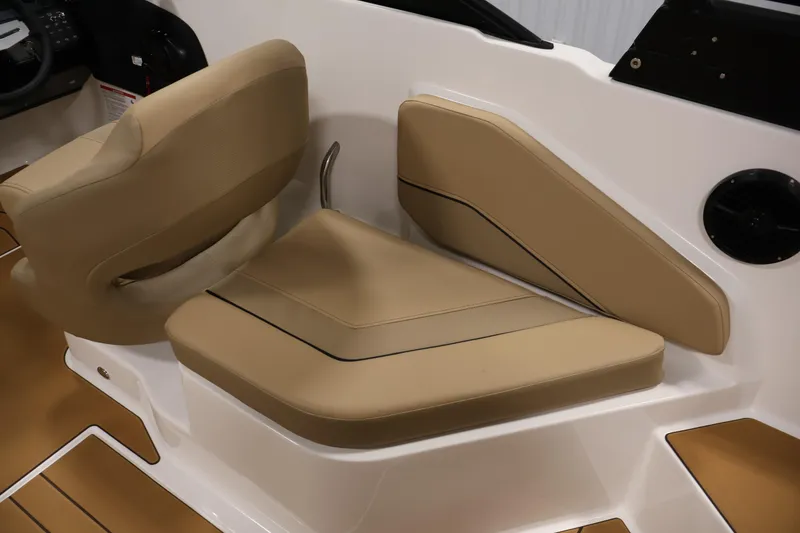 Slide: The Image of 2026 Bayliner V20 boat interior with tan seating and modern design. - 29