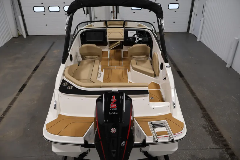 Slide: The Image of 2026 Bayliner V20 boat interior with tan seating and powerful 175 V6 engine. - 9