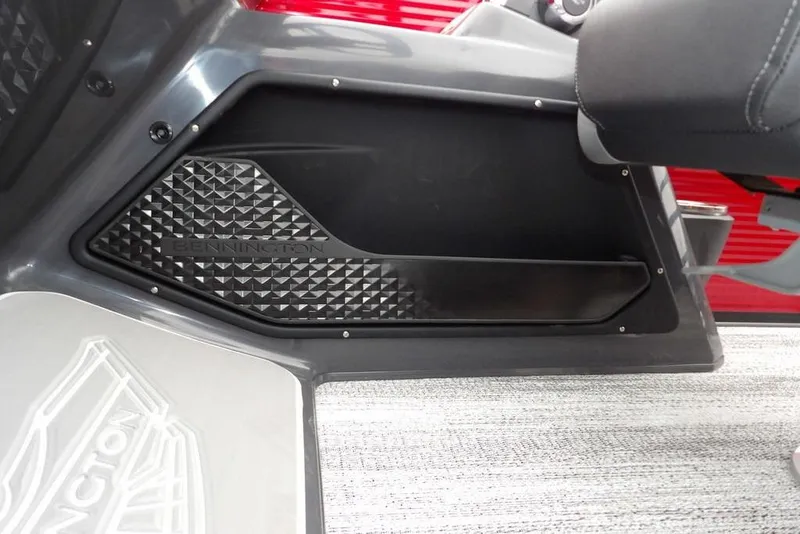 Slide: The Image of 2026 Bennington M Swingback 22 MSB interior detail with textured panel and logo. - 24