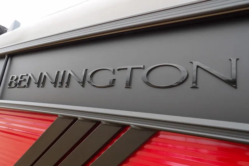 Slide: The Image of 2026 Bennington M Swingback 22 MSB logo on sleek black and red surface. - 47