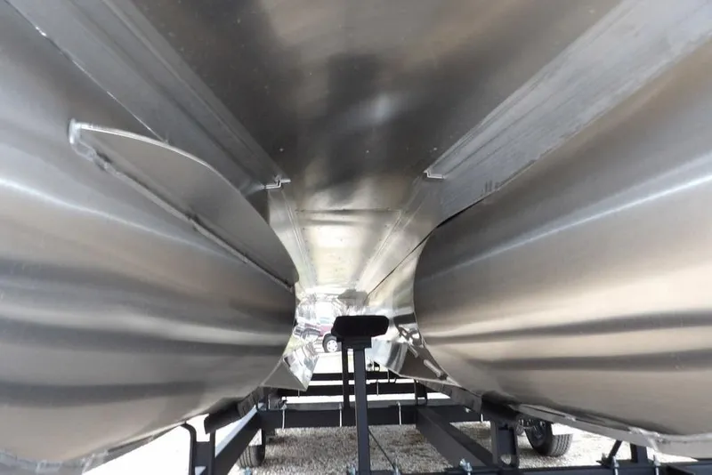 Slide: The Image of Underneath view of 2026 Bennington M Swingback 22 MSB pontoon boat on trailer. - 49