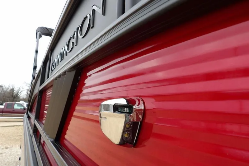 Slide: The Image of 2026 Bennington M Swingback 22 MSB, red exterior detail with chrome accent. - 51