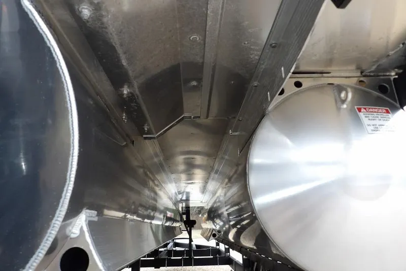 Slide: The Image of Underneath view of 2026 Bennington M Swingback 22 MSB pontoon boat, showcasing metallic structure. - 54