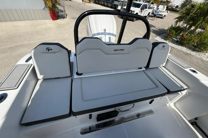Slide: The Image of 2025 Sea Pro 245FLX Sandbar boat interior with cushioned seating and sleek design. - 15