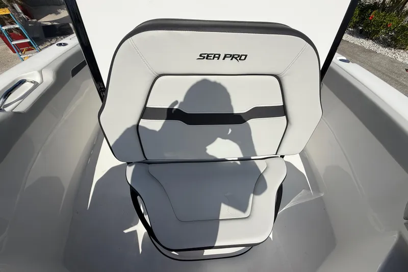 Slide: The Image of 2025 Sea Pro 245FLX Sandbar boat seat with shadow, showcasing sleek design. - 28