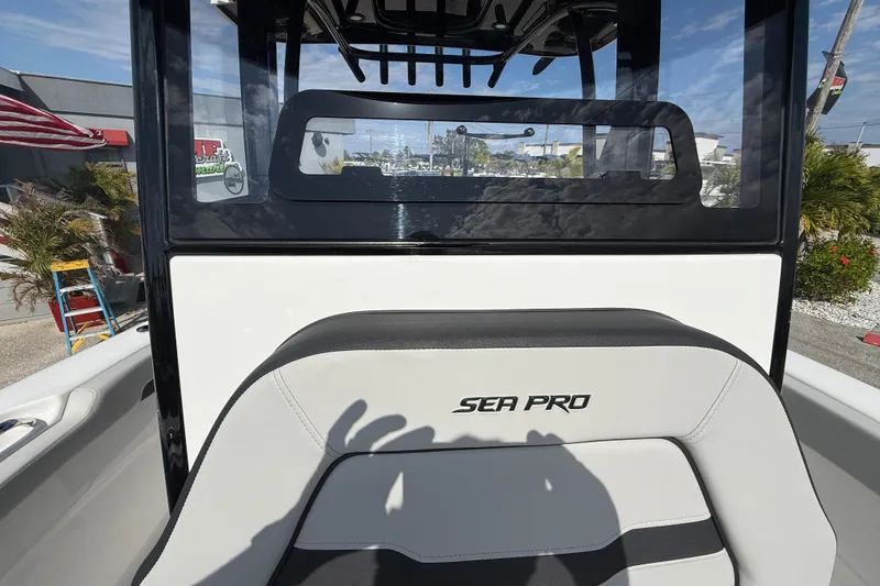 Slide: The Image of 2025 Sea Pro 245FLX Sandbar boat interior with logo and seating. - 29