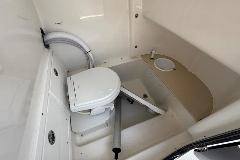 Slide: The Image of 2025 Sea Pro 245FLX Sandbar boat interior with toilet and sink. - 33