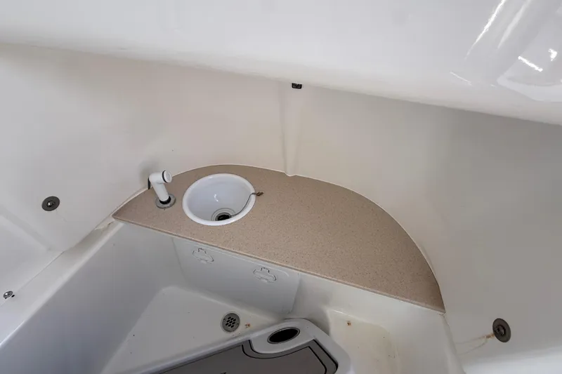 Slide: The Image of 2025 Sea Pro 245FLX Sandbar boat interior sink and countertop detail. - 36