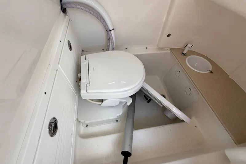 Slide: The Image of 2025 Sea Pro 245FLX Sandbar boat interior with toilet and sink. - 37