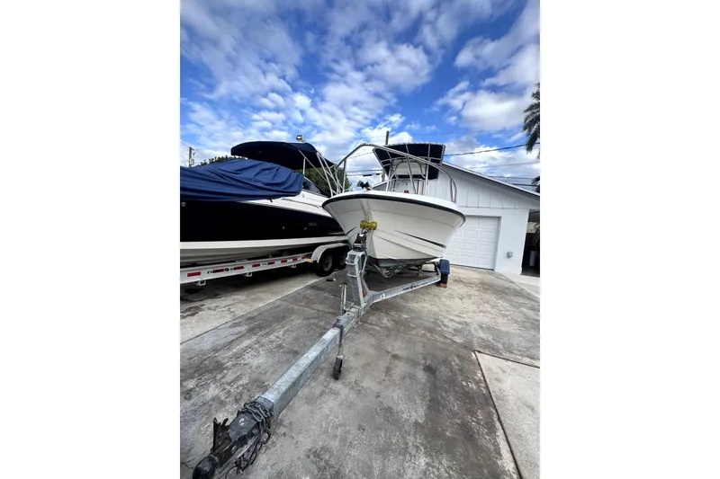 The Image of 1993 Hydra-Sports Bay Bolt 1900 boat on trailer, displayed outdoors under clear blue sky. - 0