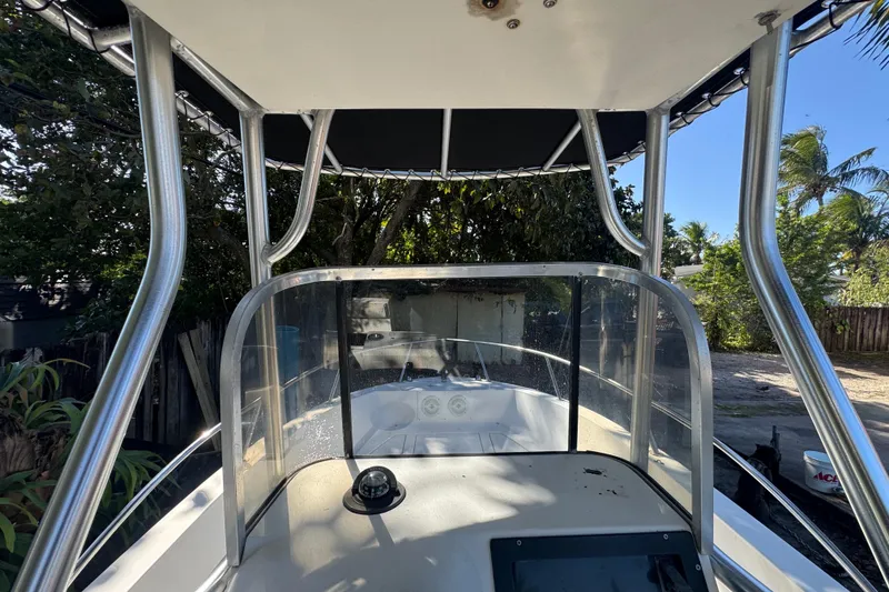 Slide: The Image of 1993 Hydra-Sports Bay Bolt 1900 boat cockpit with steering wheel and controls. - 15