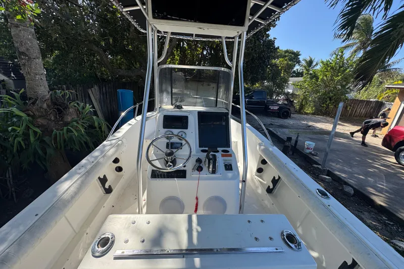 Slide: The Image of 1993 Hydra-Sports Bay Bolt 1900 boat dashboard with steering wheel and controls. - 17