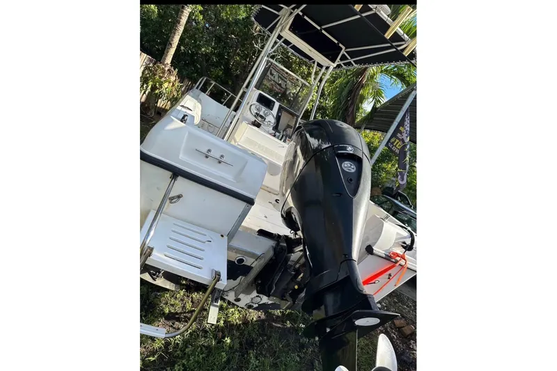 Slide: The Image of 1993 Hydra-Sports Bay Bolt 1900 boat with outboard motor, parked outdoors. - 3