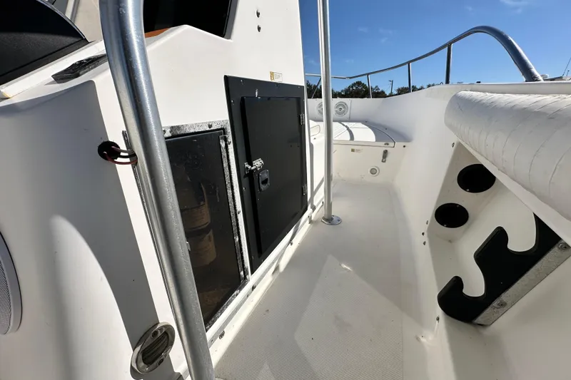 Slide: The Image of 1993 Hydra-Sports Bay Bolt 1900 boat interior with seating and storage compartments. - 32