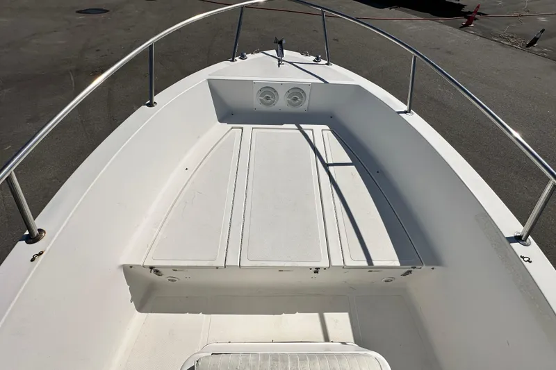 Slide: The Image of 1993 Hydra-Sports Bay Bolt 1900 boat deck, featuring spacious seating and storage. - 36