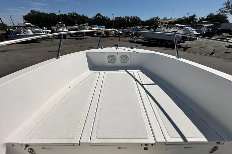 Slide: The Image of 1993 Hydra-Sports Bay Bolt 1900 boat deck, parked in a marina with other boats. - 37