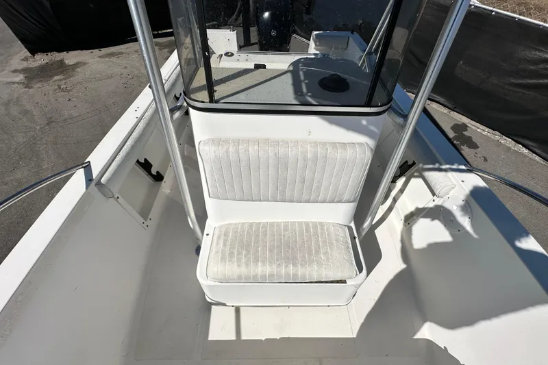 Slide: The Image of 1993 Hydra-Sports Bay Bolt 1900 boat interior with white seating and console. - 51
