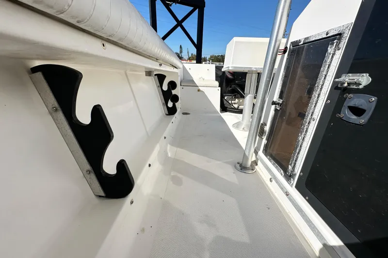 Slide: The Image of 1993 Hydra-Sports Bay Bolt 1900 boat interior with rod holders and storage compartments. - 55