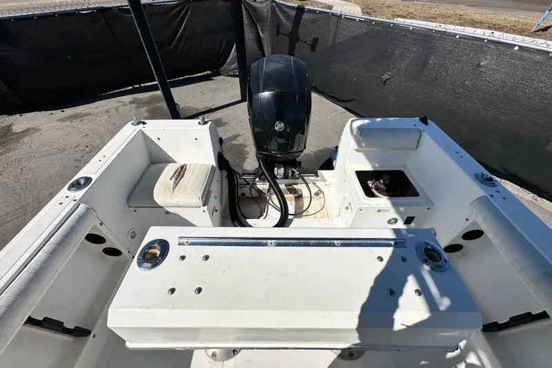 Slide: The Image of 1993 Hydra-Sports Bay Bolt 1900 boat interior with motor, seating, and storage compartments. - 57