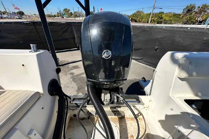 Slide: The Image of 1993 Hydra-Sports Bay Bolt 1900 boat with outboard motor, parked outdoors. - 63