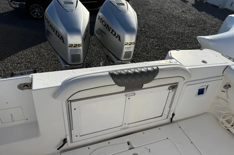 Slide: The Image of 2006 Everglades 260 Center Console with twin Honda 225 engines, rear seating view. - 9