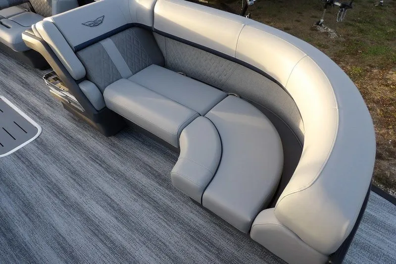 Slide: The Image of 2026 Bennington M Swingback 22 MSB boat interior with luxurious gray seating and modern design. - 13
