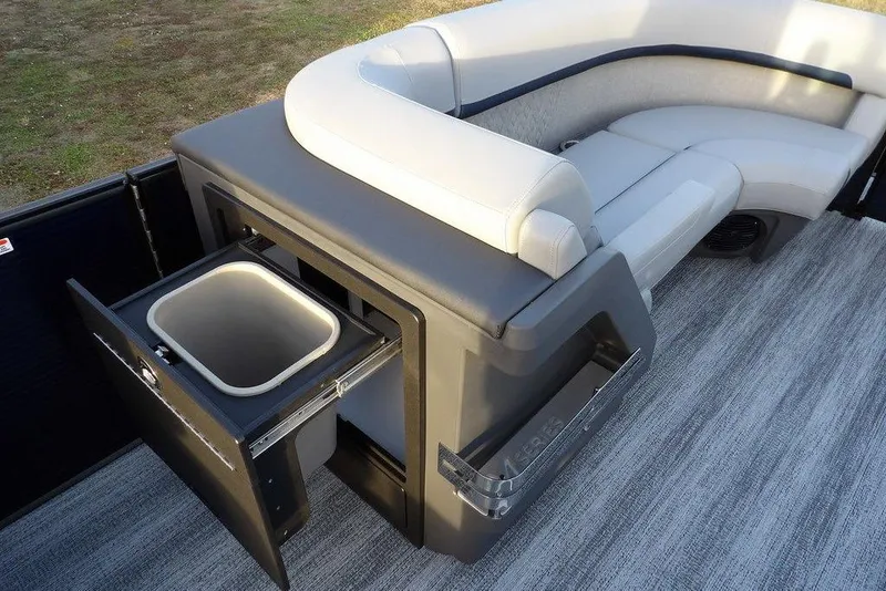 Slide: The Image of 2026 Bennington M Swingback 22 MSB boat interior with seating and storage compartment. - 14