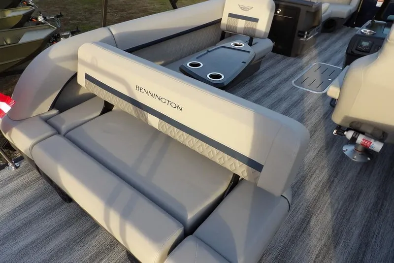 Slide: The Image of 2026 Bennington M Swingback 22 MSB interior with plush seating and cup holders. - 27