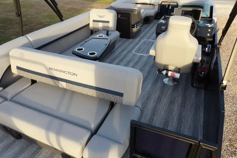 Slide: The Image of 2026 Bennington M Swingback 22 MSB pontoon boat interior with plush seating and modern design. - 31